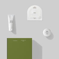 Load image into Gallery viewer, An overhead view of the Balanced Skin Set featuring its moss green outer packaging box. The set includes full-size versions of the Gentle Elements Cleansing Foam, Sound Renewal Serum Cream, and Calm Movements Eye & Cheek Mask, emphasizing a complete and aesthetic skincare gift set.