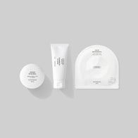 Load image into Gallery viewer, A top-down product lineup of the Modern Traveler kit by Superegg. The set includes Gentle Elements Cleansing Foam, Kind Atmosphere Biome Mist, Calm Movements Eye & Cheek Mask, Sound Renewal Serum Cream, This Moment Hand Care, and Infinite Layers Lip Care, all in minimalist white packaging.