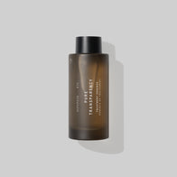 Load image into Gallery viewer, A studio shot of the Pure Transparency Treatment Essence by Superegg. The product is housed in a sleek, frosted brown PCR glass bottle with a black cap, set against a clean, minimalist grey background.