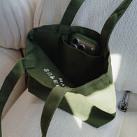 Load image into Gallery viewer, Olive green tote bag with embroidered logo SUPEREGG NYC. 