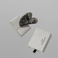 Load image into Gallery viewer, A dark green and white marbled Nine-Dragon Jade Flow Egg Sculpting Gua Sha tool by Superegg, displayed with its branded microfiber protective pouch and sliding gift box on a gray background.