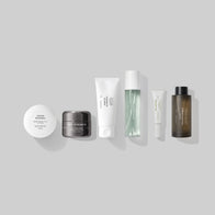 Load image into Gallery viewer, A minimalist lineup of key products from the Full Ritual Set on a light grey background. This selection includes Sound Renewal Serum Cream, Soft Strength Rich Resilience Cream, Gentle Elements Cleansing Foam, Kind Atmosphere Biome Mist, Infinite Layers Lip Care, and Pure Transparency Treatment Essence.