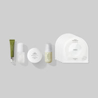 Load image into Gallery viewer, A minimalist product lineup from the Full Ritual Set on a light grey background. Featured items include Phyto Bounce Eye Contour Solution, Tonal Scenery Reparative Serum, This Moment Hand Care, Vitamin Collective Vitality Elixir, and a stack of Calm Movements Eye &amp; Cheek Masks.