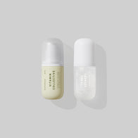 Load image into Gallery viewer, A studio shot of the two full-size serums included in the Glow &amp; Repair set: the yellow-tinted Vitamin Collective Vitality Elixir and the white Tonal Scenery Reparative Serum, displayed side-by-side against a light grey background.
