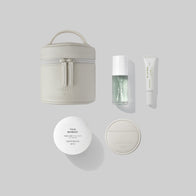 Load image into Gallery viewer, The Superegg "In My Bag" set essentials arranged on a light gray background: Little Egg Vanity Bag, Kind Atmosphere Biome Mist, Infinite Layers Lip Care, This Moment Hand Care, and Reflection Egg Compact Mirror, all featuring the SUPEREGG NYC logo.