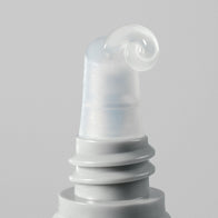 Load image into Gallery viewer, A close-up of the ∞(Infinite) Layers Lip Care applicator, showing a swirl of the clear, silky-smooth lip treatment being dispensed from the slanted tip against a minimalist grey background.