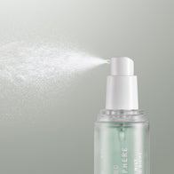 Load image into Gallery viewer, A close-up shot of the Kind Atmosphere Biome Mist bottle showing the spray nozzle in action. A fine, cloud-like mist is being dispensed from the sleek, frosted glass bottle, highlighting the product's hydrating and soothing application as part of the Full Ritual Set.