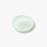 Load image into Gallery viewer, A high-resolution texture close-up of the Kind Atmosphere Biome Mist. The image features a single, clear, and slightly milky droplet of the watery liquid against a clean white background, showcasing its lightweight and hydrating consistency.