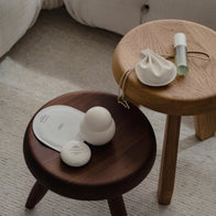 Load image into Gallery viewer, A lifestyle flat lay of the Lucky Egg Duru Pouch and other Superegg skincare products arranged on two minimalist wooden side tables. The cream-colored pouch is shown alongside the Sound Renewal serum cream and Kind Atmosphere Biome Mist, emphasizing its role in a clean, modern lifestyle.