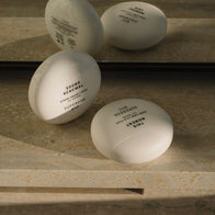 Load image into Gallery viewer, A lifestyle shot of the New Yolker set by Superegg, featuring the signature egg-shaped containers for Sound Renewal and This Moment. The products are arranged on a stone surface with their yellow and white minimalist packaging, reflecting a clean and modern skincare aesthetic.