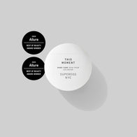 Load image into Gallery viewer, A top-down shot of the This Moment Hand Care in its signature white egg-shaped container. The image features the 2023 and 2024 Allure Best of Beauty Award Winner badges, highlighting this nature-aromatic hand cream's excellence against a soft grey background.