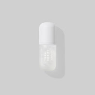 Load image into Gallery viewer, A minimalist studio shot of the Tonal Scenery Reparative Serum bottle. The sleek white bottle is centered against a soft grey background with a gentle side shadow, highlighting its clean design as part of the Biome Barrier Duo.