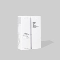 Load image into Gallery viewer, A studio shot showing the minimalist white outer packaging of the Gentle Elements Cleansing Foam. The box highlights key ingredients including Moringa Oil, Vitamin C, AHA, Adenosine, Tremella Mushroom, and Rice Extract, emphasizing its nourishing and brightening formula.