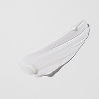 Load image into Gallery viewer, A close-up texture swatch of the Phyto Bounce Eye Contour Solution. The image shows a smooth, creamy white streak of the product against a light grey background, highlighting its light and bouncy jelly-like consistency.